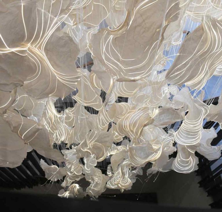 A close-up view of artist Anke Neumann’s light sculpture Cloud of Imagination, commissioned by the Folger Shakespeare Library for its new east lobby stairs leading to the historic theater above.